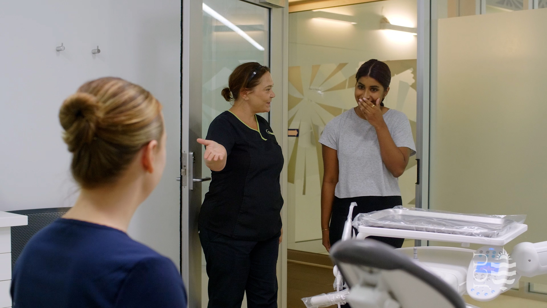 nurse showing the way for a dental patient. 