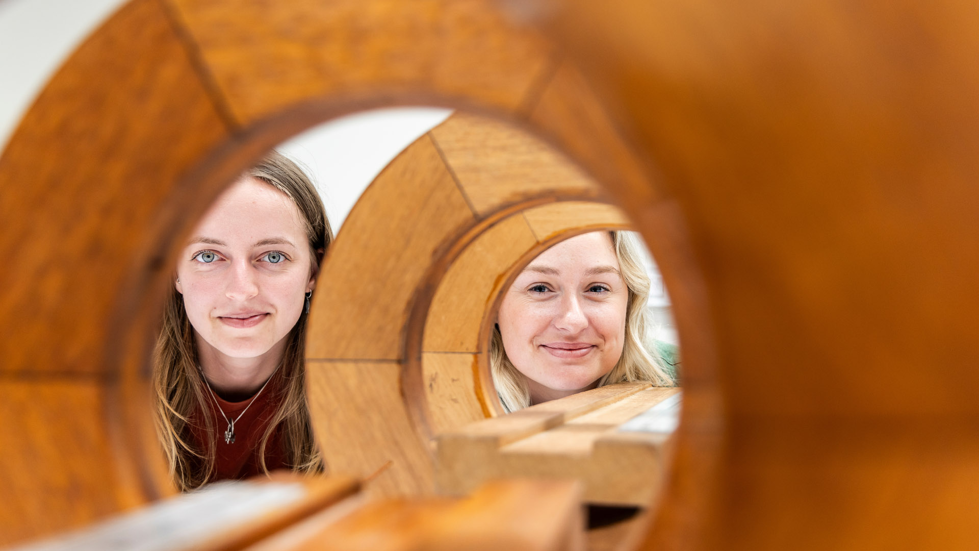 JCU students look down at the project they are working on within the Engineering and Innovation Place building. 