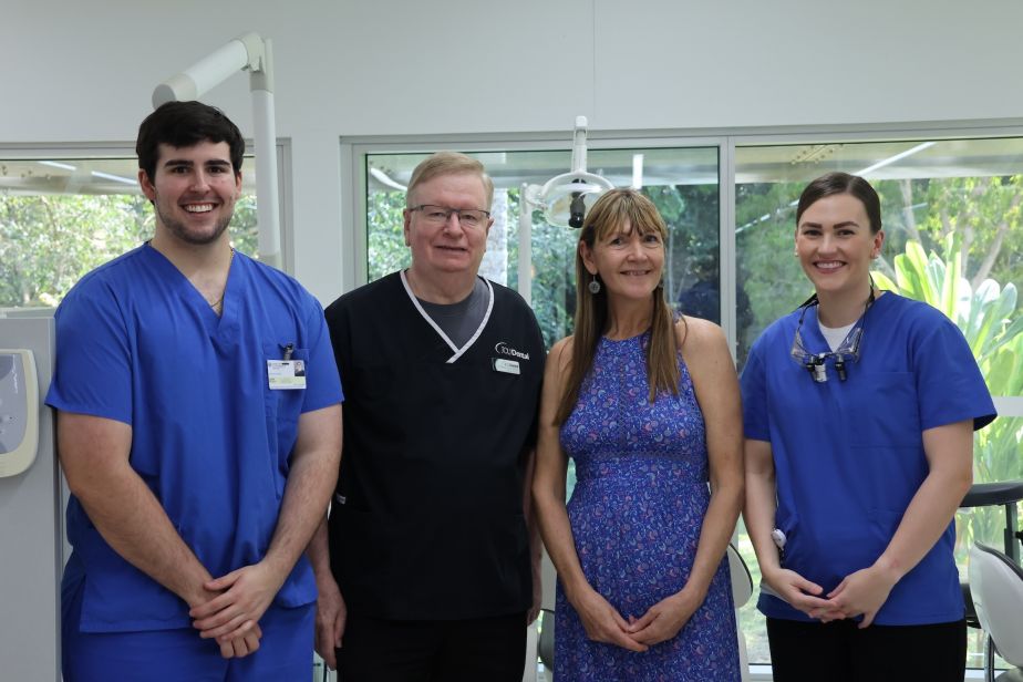 Four people standing at the JCU Dental Clinic in Cairns.